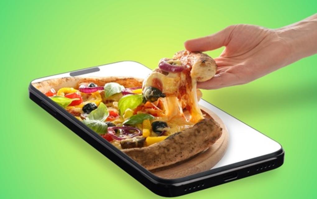 Pedaço de pizza saindo de celular - aumentar vendas no Instagram
